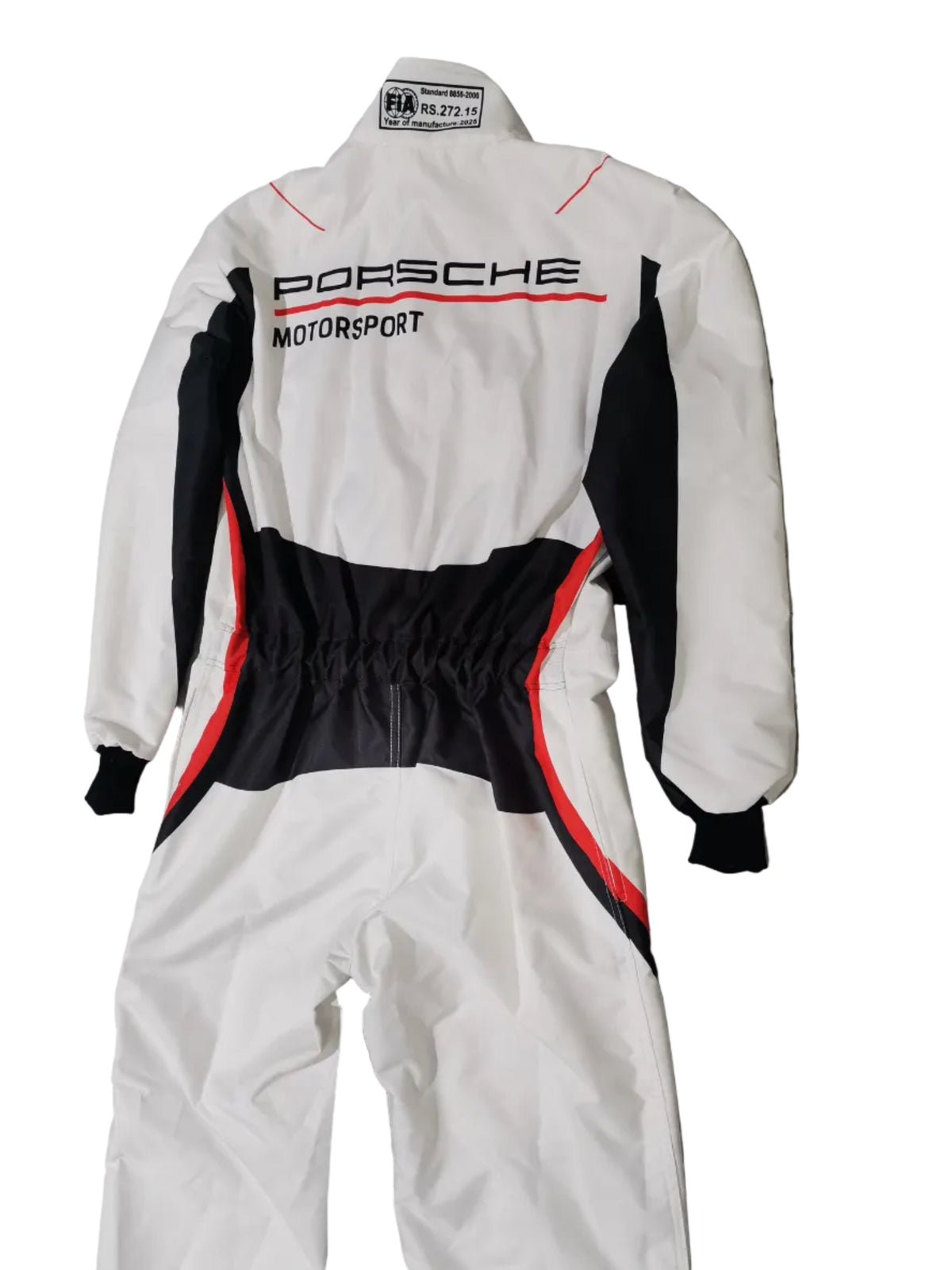 A white one-piece racing suit with black and red accents, featuring 'PORSCHE MOTORSPORT' printed vertically on the back, laid flat on a gray marble-patterned floor.